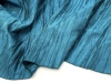 时装褶皱凹造型设计宝石蓝光泽，廓形不规则，褶皱面料半裙风衣布料