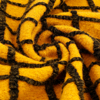 甜美风姜黄色黑色格线提花，针织羊毛毛呢毛料布料大衣设计师面料