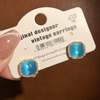 海蓝色猫眼水晶甜美方形耳钉小众设计感微镶锆石气质耳饰s925银针